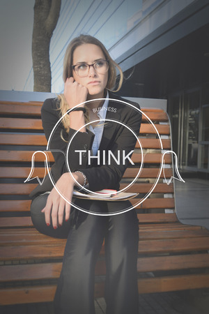 Young business woman with think text. Business conceptの写真素材