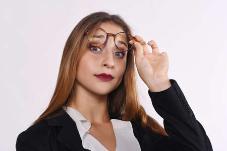 Close up of a beautiful businesswoman. Isolated white background.の写真素材