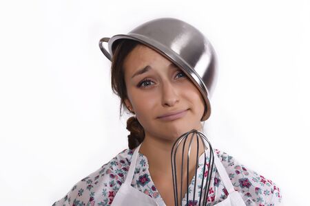 Close up of young beautiful chef tired. Isolated white background.の写真素材