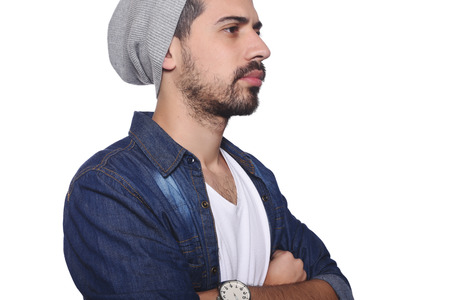 Close up of young latin man serious. Isolated white background.の写真素材