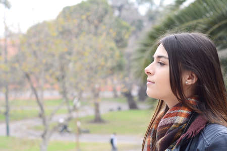 Portrait of a young beautiful woman outdoors.