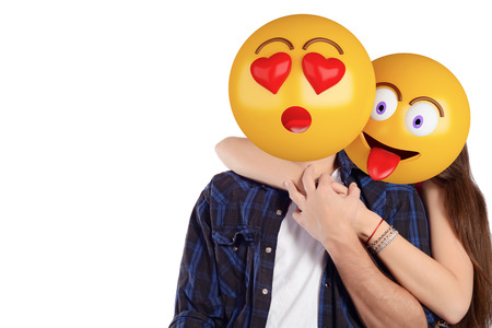 Portrait of an emoji head man and woman. Emoji and love concept. Isolated white background.の写真素材