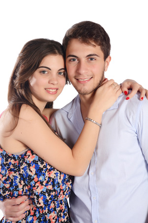 Portrait of a young beautiful couple in love. Isolated white background.の写真素材