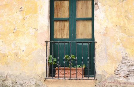 Front view of a window of an old house.の写真素材