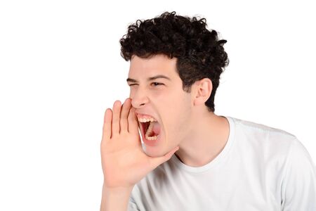 Portrait of a young man shouting. Isolated white background.