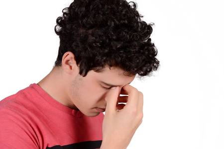 Portrait of a young man worried. Isolated white background.の写真素材