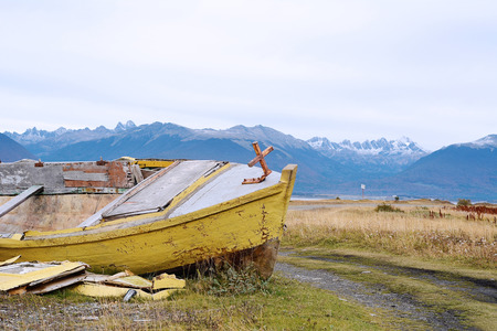 Old wooden boat abandoned ashore.の写真素材