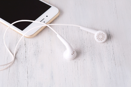 Close-up of earphone on modern phone. Technology conceptの写真素材