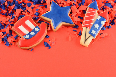 Patriotic cookies for 4th of July on red background. Independence day conceptの写真素材