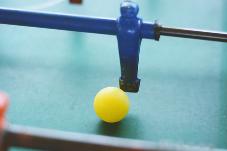 Foosball Soccer table game, blue foosball player. Toy sport game concept.