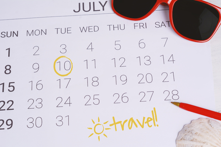 Summer Calendar Schedule with summer beach accessories. Holiday concept.の写真素材