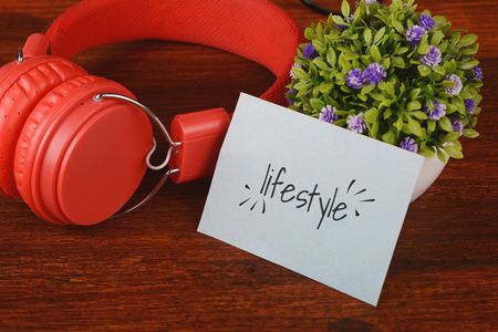 Close up view of red headphones and paper card withの写真素材