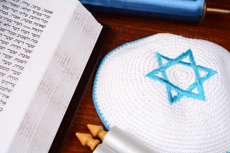 Torah with kippah on wooden background. Jewish religion conceptの写真素材
