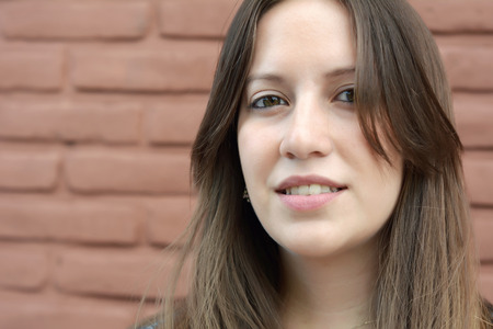 Portrait of young beautiful woman outdoors. Urban concept.の写真素材