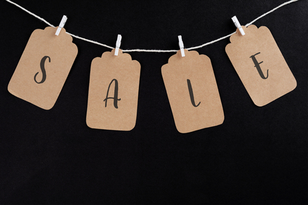 Sale tag with discount witen in it on black background. Black friday conceptの写真素材