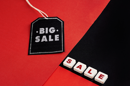 Sale tag with discount witen in it on black and red background. Black friday conceptの写真素材