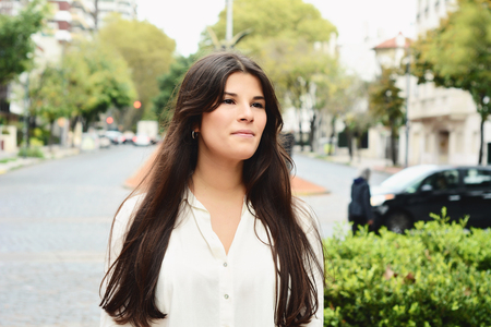 Close up of a young beautiful woman outdoors.の写真素材