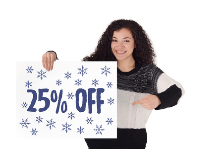 Young latin woman holding a sign with 25% off promotion. Winter sale concept. Isolated white background.の写真素材