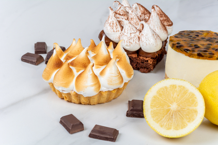 Close-up to delicious chocolate, lemon pie and passion fruit cake.の写真素材