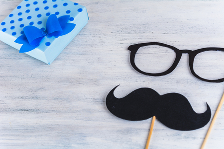 Photo booth mustache with space for your text on wooden background. Father Dayの写真素材