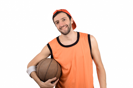 Portrait of young man with a funny expression and basketball ball. Sport concept.の写真素材