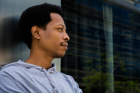 Portrait of young African American man in urban background.