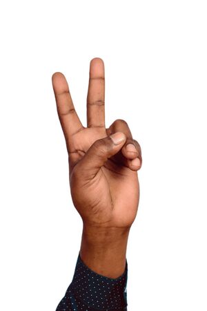 Man hand victory sign gesture. Hand with two fingers up. Isolated white backgroundの写真素材