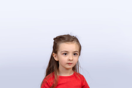 Portrait of a beautiful little girl on studio.の写真素材