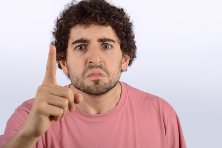 Portrait of young man who is angry with someone.
