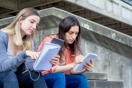 Two University students studying together at the building of university. Education conceptの写真素材