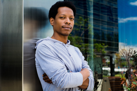 Portrait of young African American man in urban background.の写真素材
