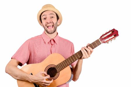 Portrait of funny man with guitar on studio. Music concept.の写真素材