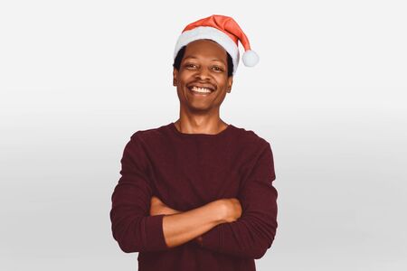 Portrait of happy american man in christmas hat. Christmas concept.の写真素材