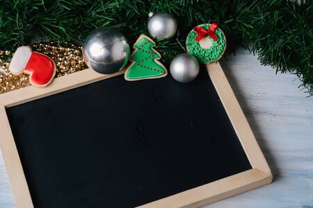 Empty chalkboard and decorative ornaments. Merry Christmas concept.の写真素材