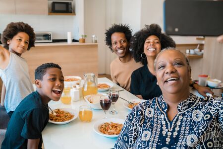 Portrait of african american multigenerational family taking a selfie together with mobile phone...