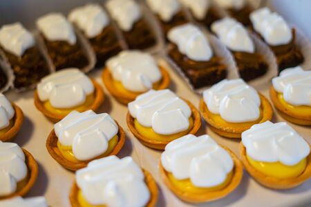 Close-up to delicious mini chocolate and lemon pie cakes.