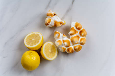 Fresh lemon pie with meringue and lemon citrus fruit.の写真素材