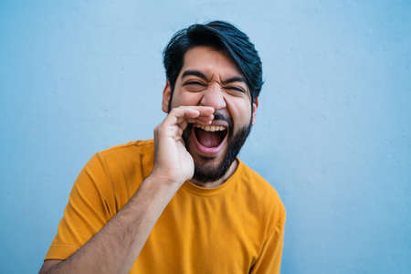 Young man shouting and screaming.の写真素材