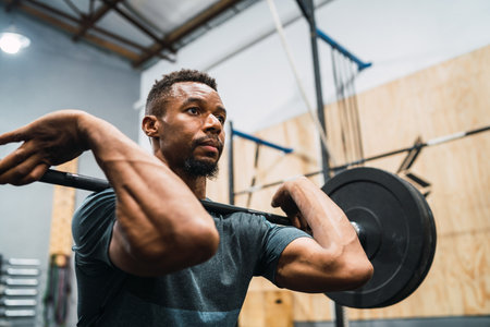Crossfit athlete doing exercise with a barbell.の写真素材