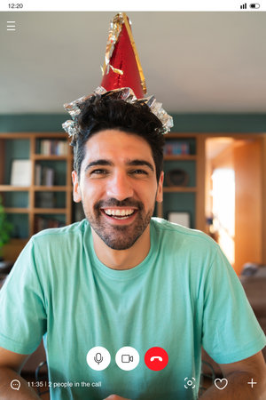 Man celebrating his birthday on a video call.