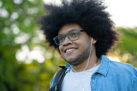 Portrait of young latin man outdoors.の写真素材