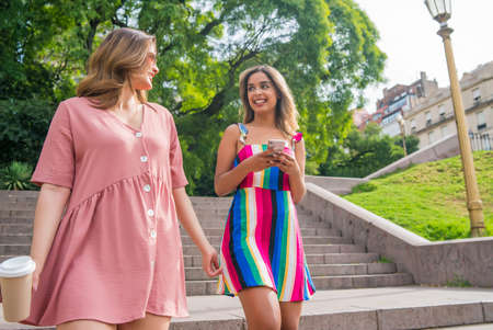 Two friends walking on the street