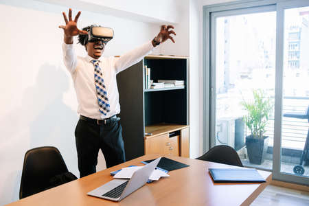 Businessman using virtual reality headset