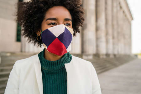 Portrait of afro business woman outdoors on the street.の写真素材