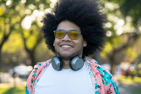 Portrait of young latin man outdoors.の写真素材