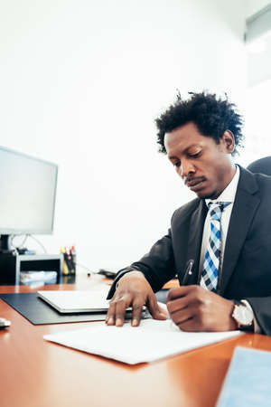 Businessman working at his modern office.の写真素材