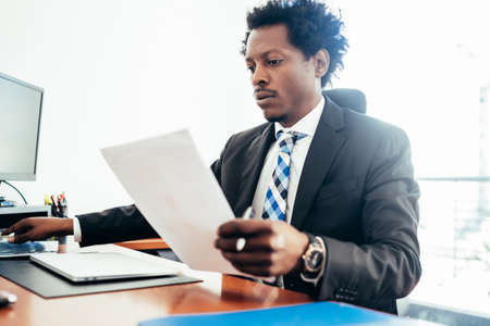 Businessman working at his modern office.の写真素材