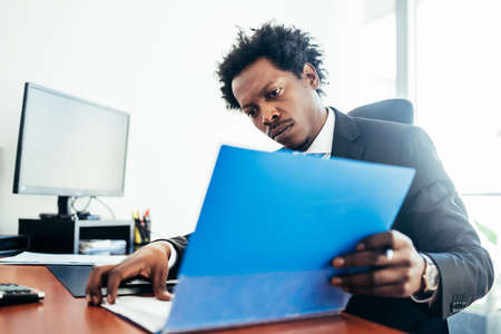 Businessman working at his modern office.の写真素材