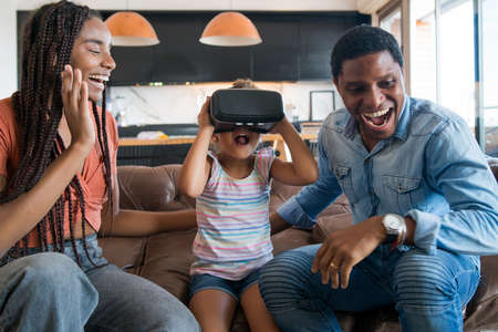 Family playing video games with VR glasses.の写真素材