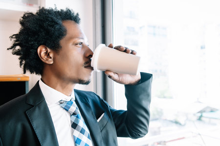 Businessman drinking coffee on a break from work.